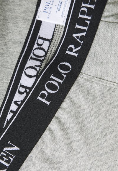 Stretch katoenen shorts in heather grijs met een zwarte elastische tailleband waarop in witte letters "POLO RALPH LAUREN" staat. Gevoerde zakdetails met rits.