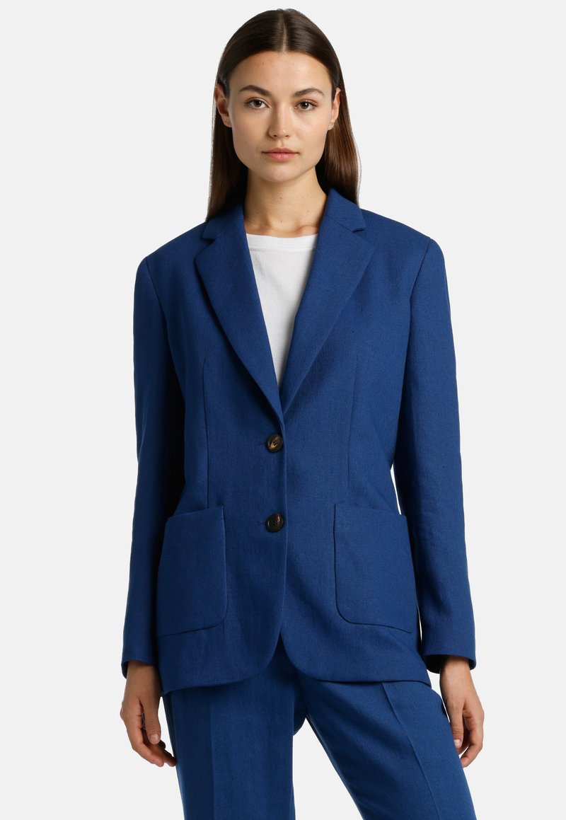 Blue linen blazer featuring a tailored fit, notched lapels, two front pockets, and brown button closure. Simple and modern design.