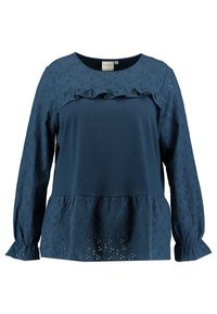Top a maniche lunghe blu navy con scollatura a volant, dettagli in pizzo e orlo arricciato. Tessuto morbido con accenti testurizzati sulle maniche.