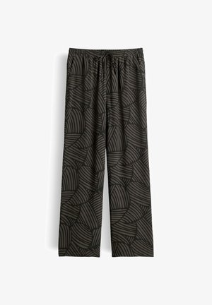 Schwarze und dunkelgraue Hose mit weitem Bein, elastischem Bund und Kordelzug, mit abstraktem, gebogenem Streifenmuster.