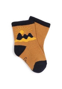 Chaussettes jaunes et marines avec un motif de montagne et de soleil, texture côtelée, avec un revers et des accentuations en marines au niveau des orteils.