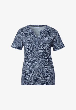 Námořnický modrý krátký rukáv top s výstřihem do V a abstraktním bílým zigzag vzorem. Vyrobeno z měkkého materiálu, má volný střih a boční švy.