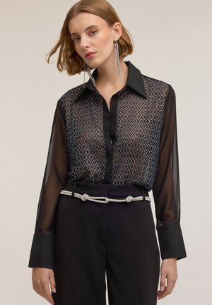 CON APPLICAZIONE GEOMETRICA DI STRASS - Blus - nero