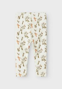 Bloemleggings van ribstof, met een licht crèmekleurige achtergrond versierd met roze en groene botanische patronen. Elastische tailleband.