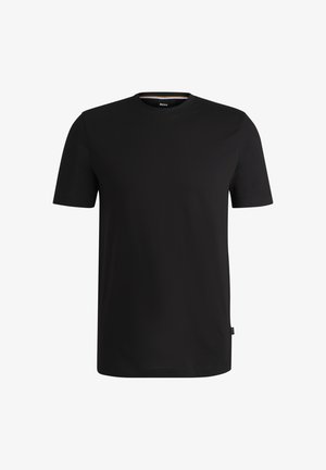 Camiseta corta negra de algodón suave con cuello redondo. Presenta una sutil etiqueta de la marca en el lado izquierdo cerca del dobladillo.