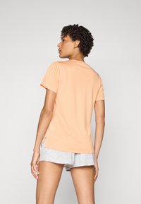 New Balance ESSENTIALS - Športové tričko - dried orange