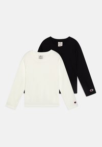 T-shirt in cotone a maniche lunghe, in bianco e nero, con scollatura rotonda e dettagli con logo sulle maniche, esposti insieme.