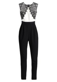 Combinaison noire avec une silhouette ajustée, comportant un corsage blanc orné de délicates dentelles noires le long de l'encolure.