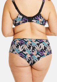 Haut et bas de bikini à motif floral coloré, avec un fond noir et des feuilles vibrantes en turquoise, violet et orange.