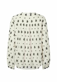 Blusa a maniche lunghe, color crema con motivo floreale nero. Presenta dettagli arricciati sul retro e polsini elasticizzati. Tessuto morbido.