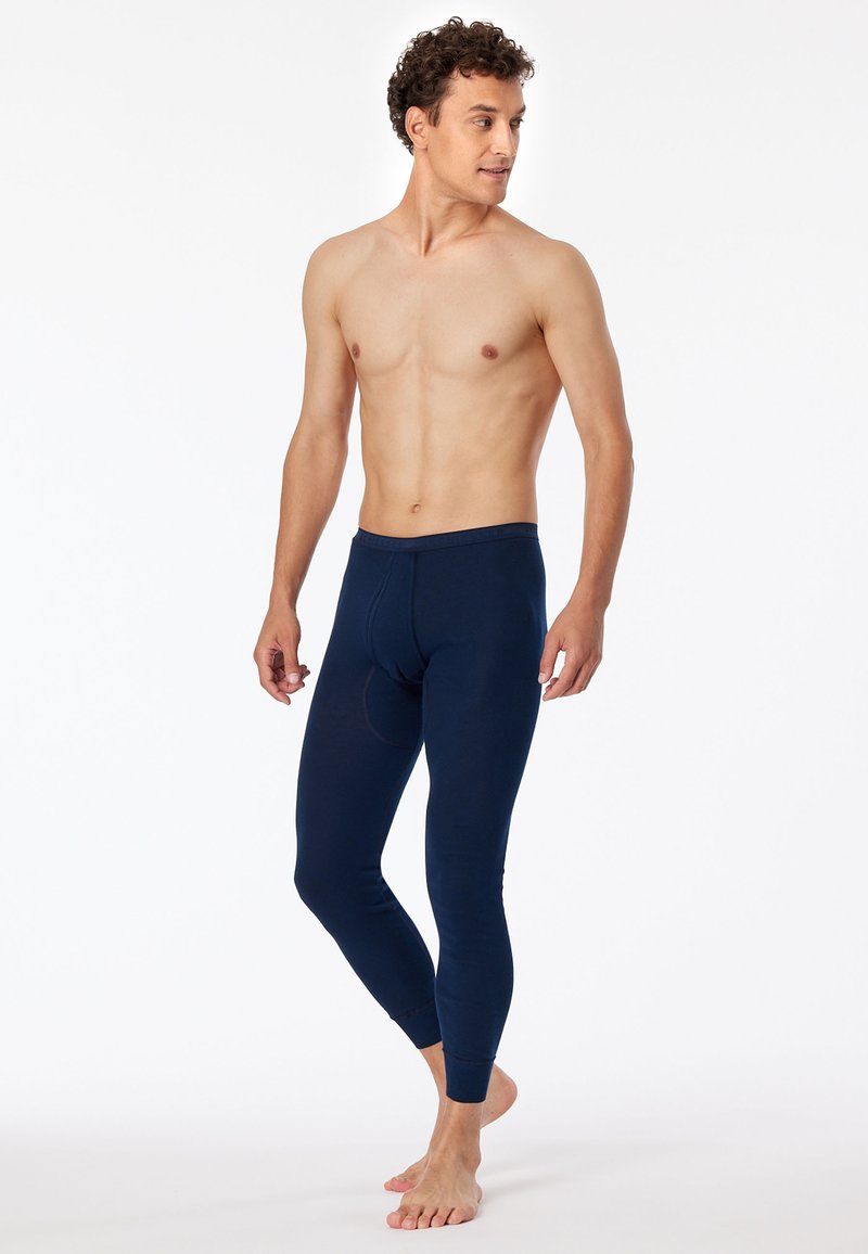 Leggings longs bleu marine en tissu extensible, offrant une coupe près du corps, une taille élastique et une poche avant pour le soutien.