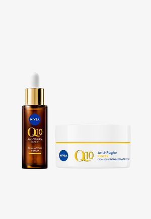 Siero NIVEA Q10 in una bottiglia di vetro marrone con contagocce bianco, abbinato a un barattolo di crema bianco con accenti gialli e logo blu.