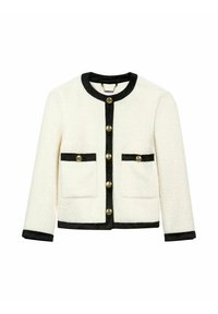 Biała kurtka o teksturowanej powierzchni z czarnymi wykończeniami i guzikami, posiadająca dwie przednie kieszenie. Okrągły dekolt i zapinanie na guziki z przodu.