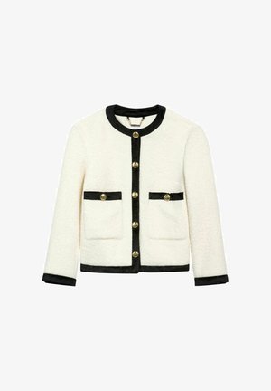 Biała kurtka o teksturowanej powierzchni z czarnymi wykończeniami i guzikami, posiadająca dwie przednie kieszenie. Okrągły dekolt i zapinanie na guziki z przodu.