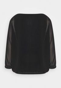 Černý vršek s boxy designem; průhledné dlouhé rukávy a kulatý výstřih; třpytivý detail na lemu; měkká textilie.