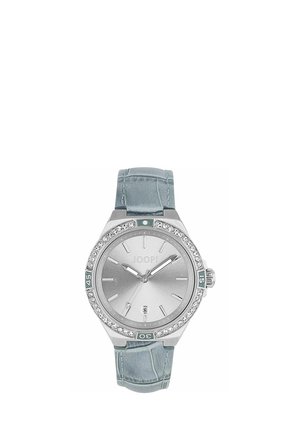 Silver Joop wristwatch with crystal-studded bezel, light blue leather strap, and date display at 6 o’clock.