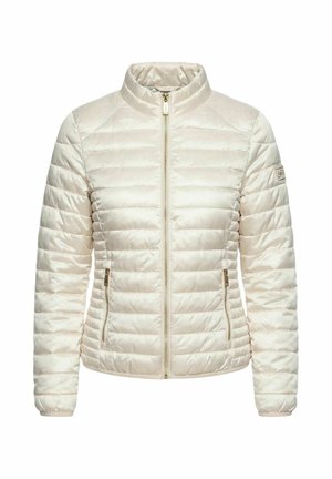 Giacca imbottita trapuntata color crema con zip frontale, collo alto, due tasche laterali con zip e una piccola toppa con logo sulla manica sinistra.