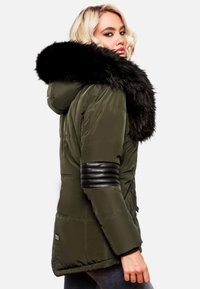 Olive green puffer jacket with a detachable black fur hood. Features ribbed black leather accents on sleeves and zippered pockets.