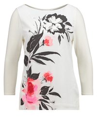 Top con stampa floreale caratterizzato da una base crema e maniche a tre quarti. Il design presenta grandi motivi di fiori neri e rosa sulla parte anteriore.