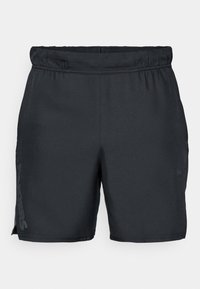 Calças de desporto pretas com um cós elástico, fendas laterais e um logo impresso na perna esquerda; feitas de um tecido leve e suave.