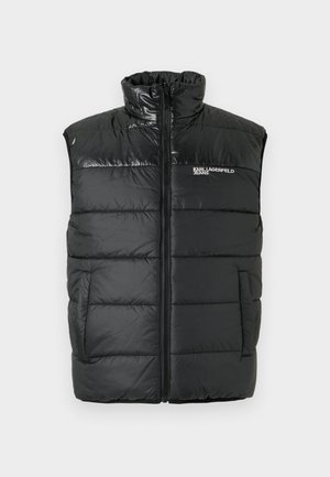 Zwarte puffer vest met hoge kraag, ritssluiting aan de voorkant en gestikte delen. Heeft discrete zijzakken en een logo op de linkerborst.