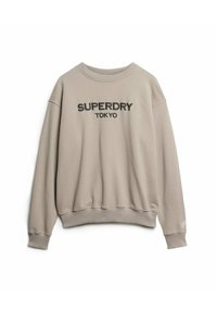 Felpa beige chiaro con scollo a costine, spalle scese e polsini. Presenta il testo stampato nero "SUPERDRY TOKYO" sulla parte anteriore.