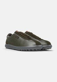 Olive green leather sneakers with gray rubber sole, round toe, and textured accents. Features lace-up design and subtle brand logo.