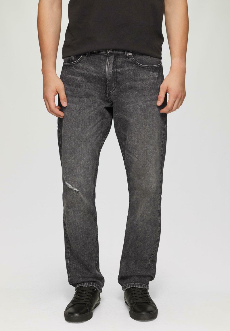 Verblasste schwarze Denim-Jeans mit geradem Bein, ausgestattet mit einem zerrissenen Knie, Stickerei-Akzenten und einem klassischen Fünf-Taschen-Design.