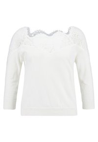 Maglione bianco con yoke in pizzo, maniche lunghe, scollo ampio e finitura testurizzata. Il corpo è morbido, in contrasto con il delicato pizzo.