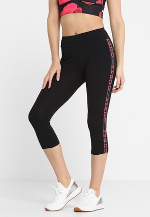 Sorte capri leggings i strækbart stof med høj talje. Har pink logo accenter på siden og en glat, slank tekstur.