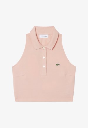 Mouwloze lichtroze korte poloshirt met drie knopen en een klein groen krokodillenlogo op de borst.