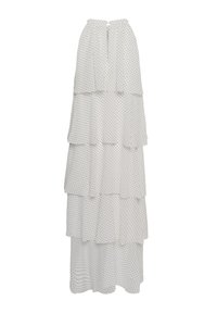 Jupe longue blanche à étages avec des pois noirs et une fermeture à bouton en forme de trou à la ceinture, présentée sur un fond blanc.