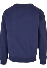 Sweat-shirt bleu marine à manches longues avec col rond, poignets et bas en côtes, vu de dos.