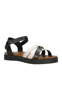 Černobílé sandály na pásky s texturovaným bílým pásem, hladkými černými pásky a pevným černým podrážkou s vzorem protiskluzu.