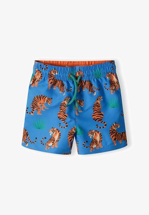 Bañadores azules con un estampado de tigre en naranja y negro, con un cordón verde y una cinturilla elástica. Incluye acentos de plantas verdes.