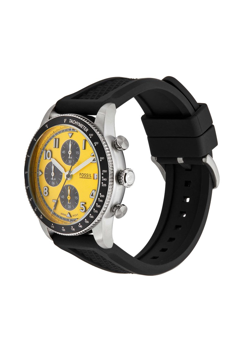Reloj de pulsera cronógrafo para hombre Fossil con esfera amarilla, subesferas negras, caja plateada, bisel taquimétrico y correa de silicona negra texturizada.