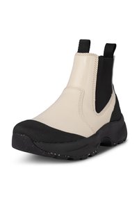 Beige vattentäta ankelstövlar med svarta textil- och gummidetaljer, elastiska sidopaneler och texturerad svart tå, utformade med en kraftig sula.