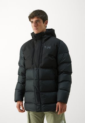 Black puffer jacket with a hood, featuring quilted sections, front zipper, and logo on the chest. Textured, lightweight fabric.