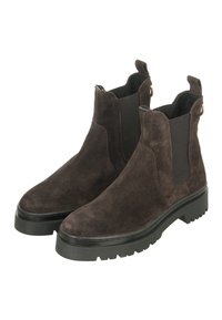 Braune Wildleder Chelsea Boots mit elastischen Seitenpaneelen, einem Zugschlaufen und einer dicken schwarzen Gummisohle mit einem genoppten Muster.