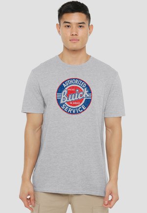 Gray short-sleeve t-shirt featuring a circular Buick logo in red and blue with text "AUTHORIZED SERVICE" and "VALVE IN HEAD" in white.