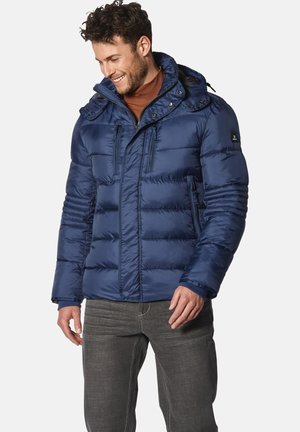 Navy blue puffer jacket with a zippered front, detachable hood, and two chest pockets. Smooth, shiny texture with horizontal quilting.