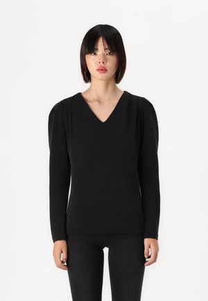 Top nero a maniche lunghe con scollo a V e leggero imbottitura sulle spalle. Tessuto morbido, design aderente e stile minimalista. Adatto per varie occasioni.