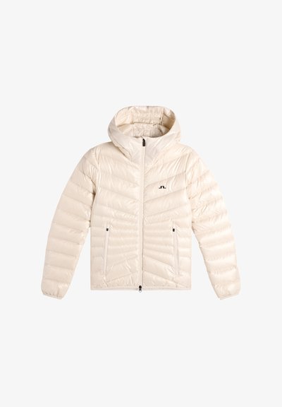 Cream-colored quilted hooded jacket with front zipper and zippered side pockets, featuring a small black logo on the chest.