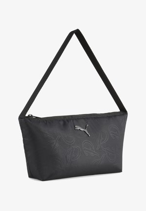 Czarna torba na ramię Puma z zamkiem błyskawicznym, subtelnymi tłoczonymi wzorami oraz srebrnym logo Puma na przodzie.