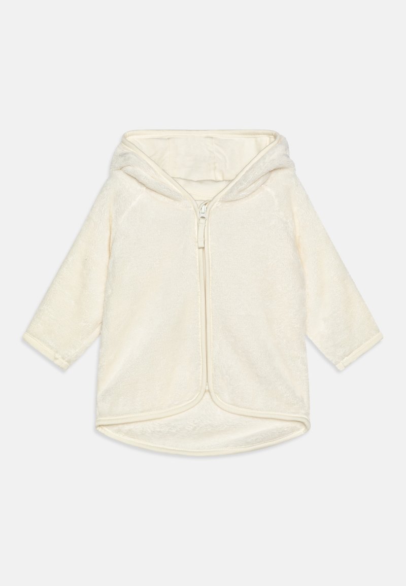 Giacca morbida per bambini in pile color crema con cappuccio e cerniera frontale, maniche lunghe e orlo arrotondato.