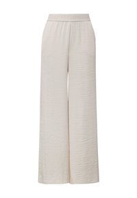 Pantalon crème à jambes larges avec taille élastique haute et tissu subtilement texturé, présenté sur fond blanc.