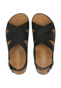 Černé sandály s křížovými pásky, korkovou stélkou a zlatou přezkou. Plná podrážka, hladký povrch a minimalistický design. Vyrobeno v Portugalsku.