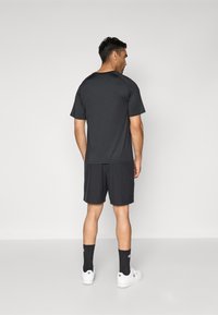 Champion TRAINING SHORTS - Calções desportivos - black