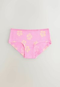 Culotte hipster féminine rose avec un motif de fleurs d'hibiscus jaune pâle sur un fond uni clair.