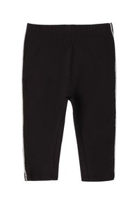 Leggings noirs en tissu doux, dotés d'une taille élastique et de bandes latérales blanches contrastées, de longueur cropped.